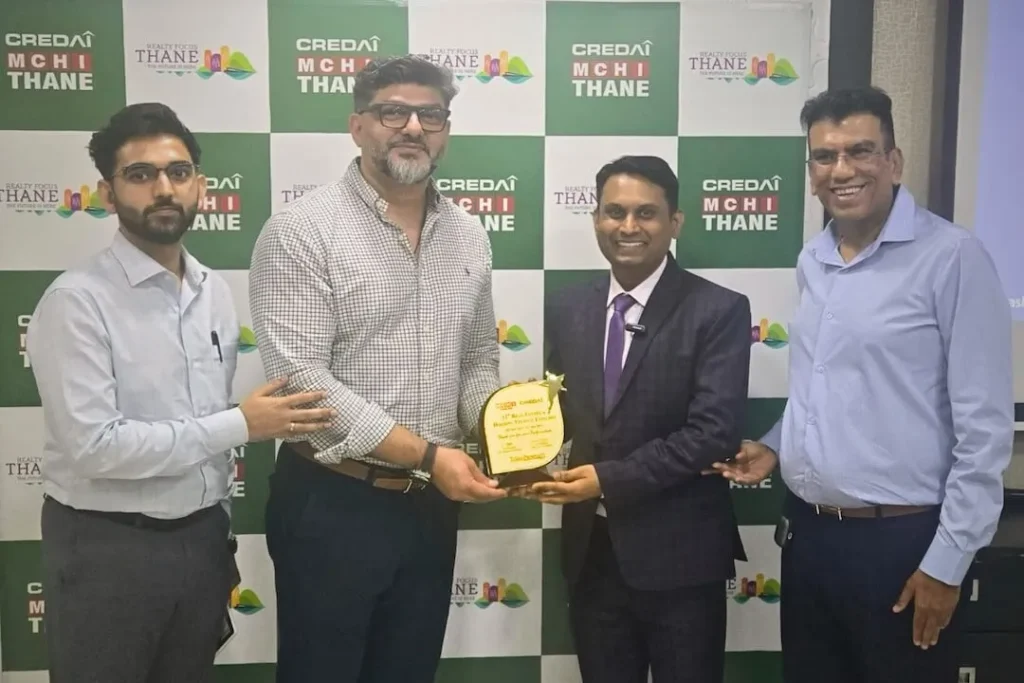 Sales transformation coach Ashish Mudra receiving an appreciation award at CREDAI-MCHI Thane event for his impactful business growth training session.