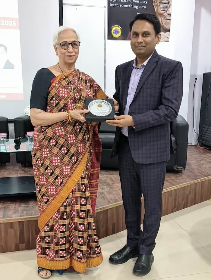 Ashish Mudra receiving an award for excellence by a veteran educationist in Mumbai, India.